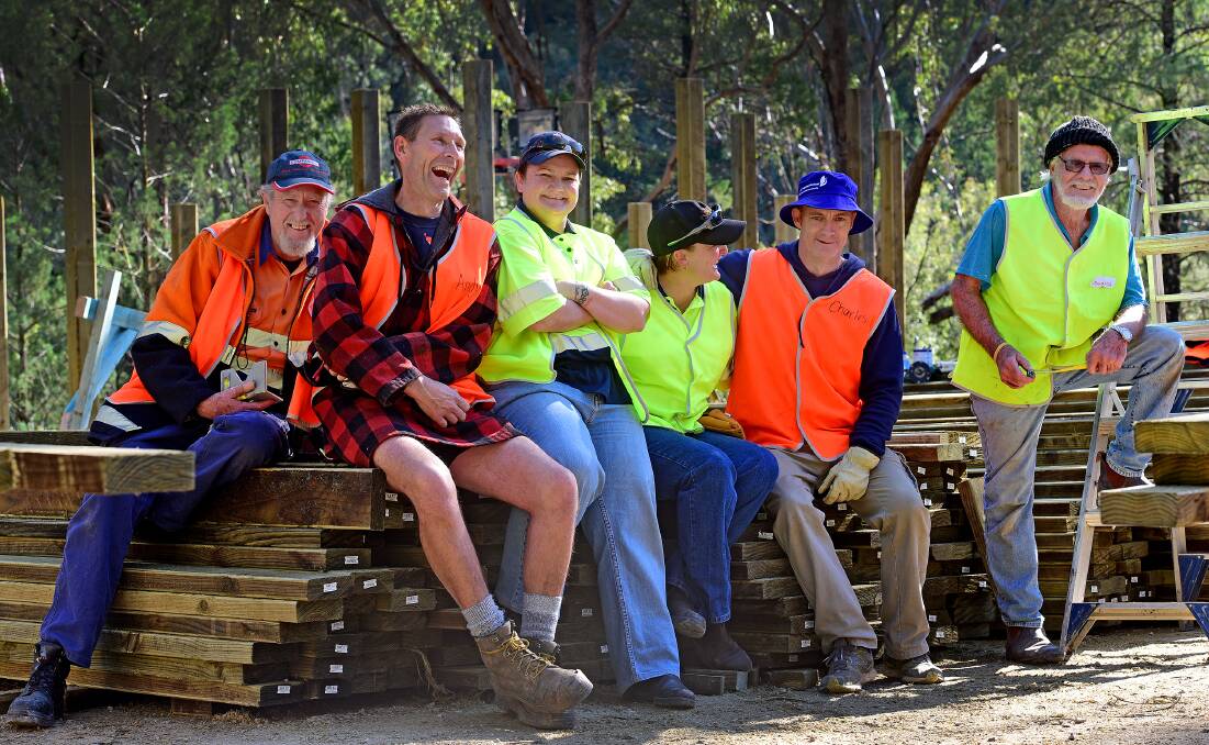 FUN ON THE JOB: Adventure playground volunteers, from left, Don Wyatt, Andrew Charlton, Tanya LeGarde, Bec Miller, organising hand Charles Impey and Doug Moffat were as excited as kids yesterday at the playground working bee. Photo: Gareth Gardner 300715GGA05