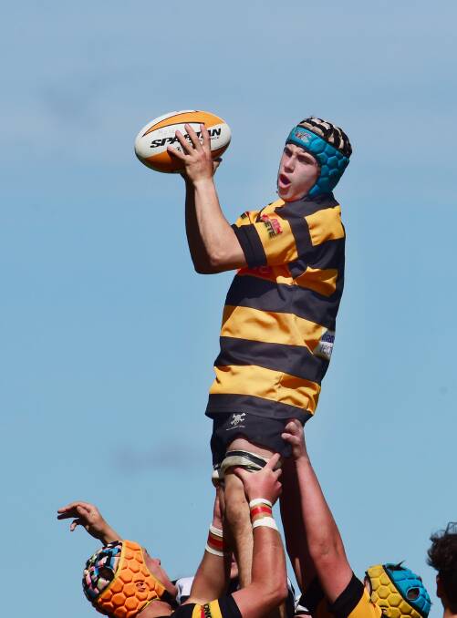 Pirates captain Jack Redfern is hoisted highin the lineout. He was named the player of the U16s grand final.  Photos: Gareth Gardner 290815GGA06