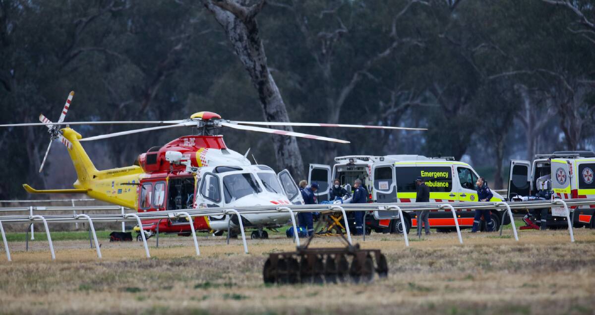 FIRST RESPONDERS: Paramedics attend to Elissa Meredith following a race fall in Gunnedah on Monday. Picture: Dockery Photography