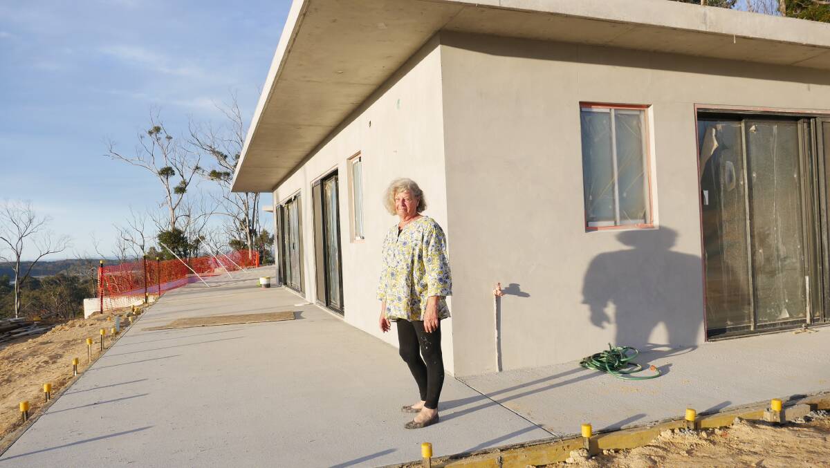 Ms Van Doorn stands in front of the Kalaru home which is due to be finished in a few weeks' time. 