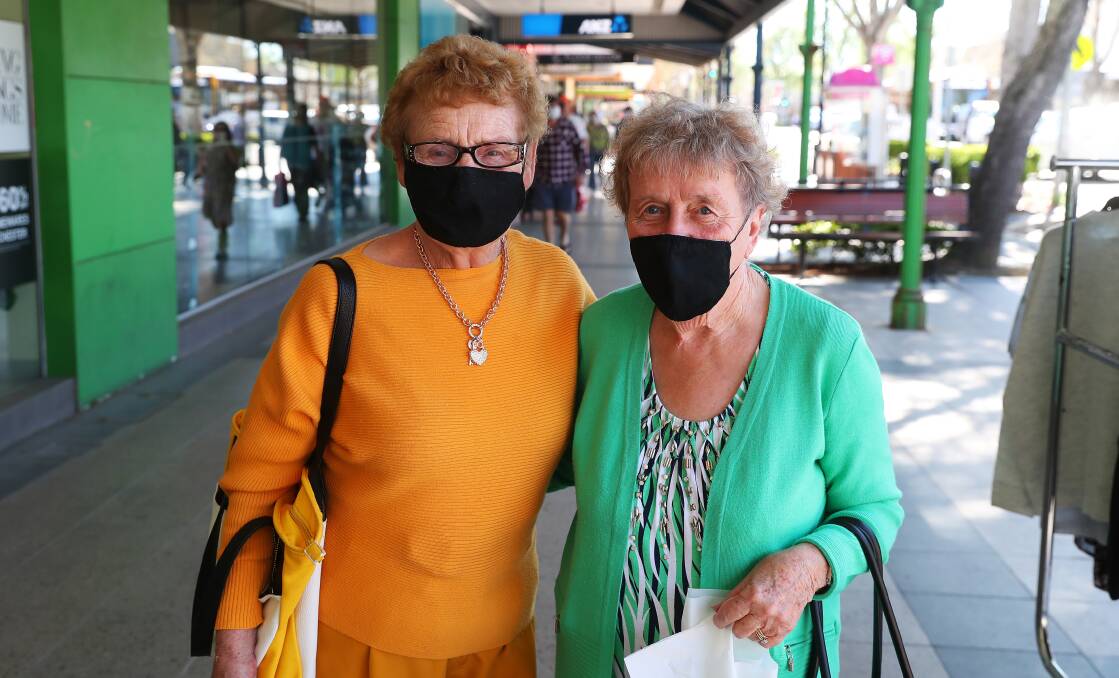 SAFETY FIRST: Patricia Bowditch and Gwen Little from Wagga wearing their face masks while shopping on the weekend. Picture: Emma Hillier