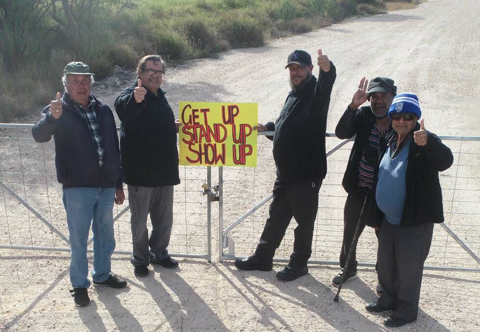 Members of the Dharriwaa Elders Group at the locked river access gate in July 2022. Picture via 