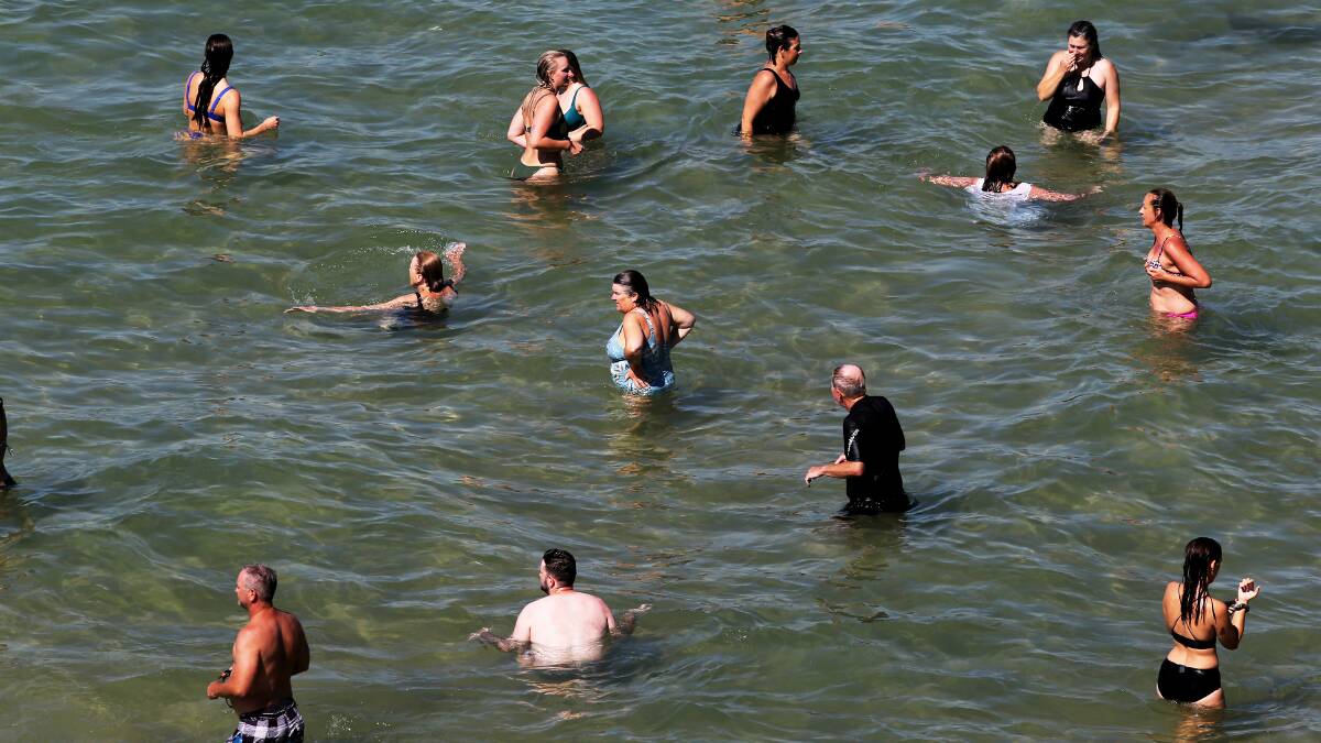 Bathers cool down in the rock pool at Bar Beach near Newcastle, NSW on February 10, 2023. Picture by Peter Lorimer