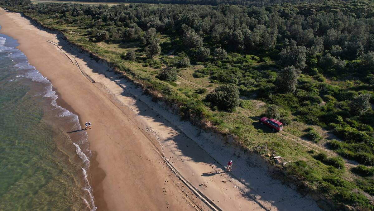 An Australian National University research team performs monthly readings of the erosion Bengello Beach on the NSW south coast using star pickets. Picture supplied.