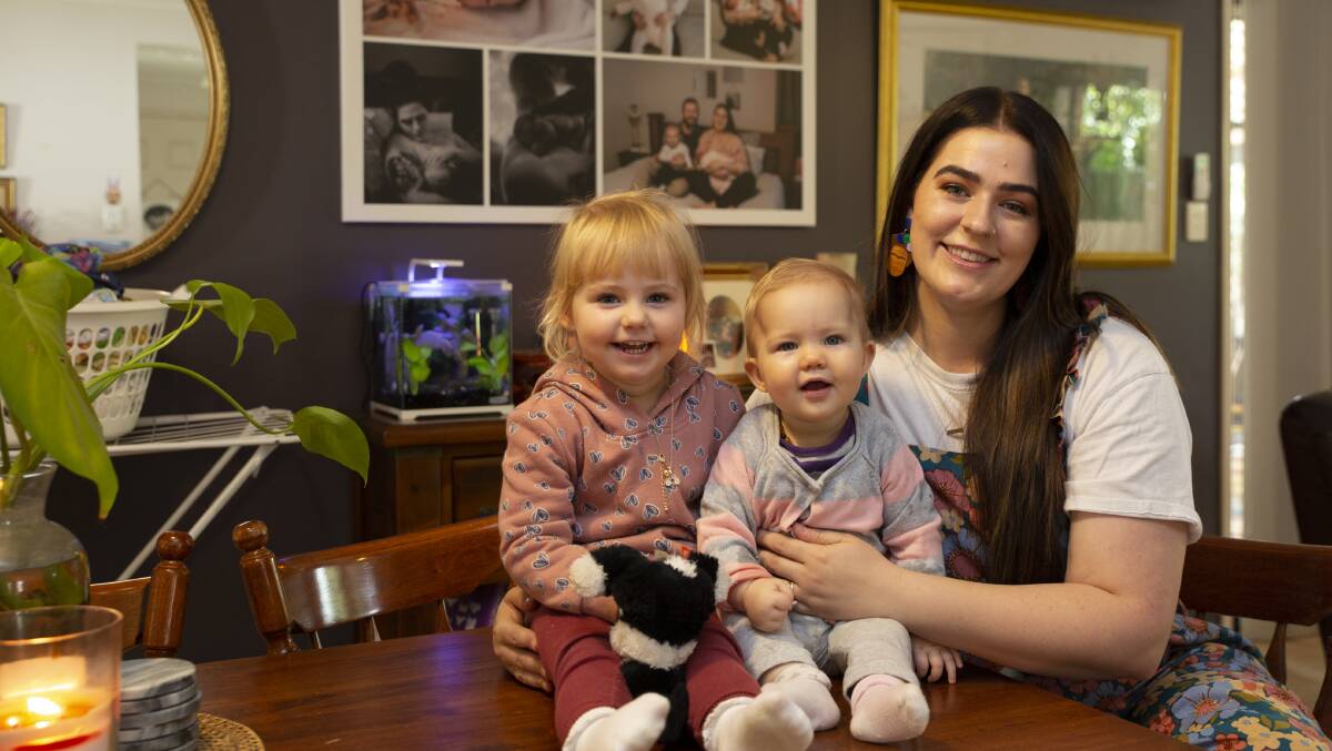 BIGGEST REWARD: Nurse and placenta encapsulation specialist Emily Day at her Wagga home on Mothers' Day with her daughters Laina and Dulcie. Picture: Madeline Begley 