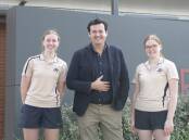BIG PICTURE: Kooringal High School students Josie Galvin and Juliet Barber with alumnus and former Wiggle Sam Moran. Picture: Madeline Begley
