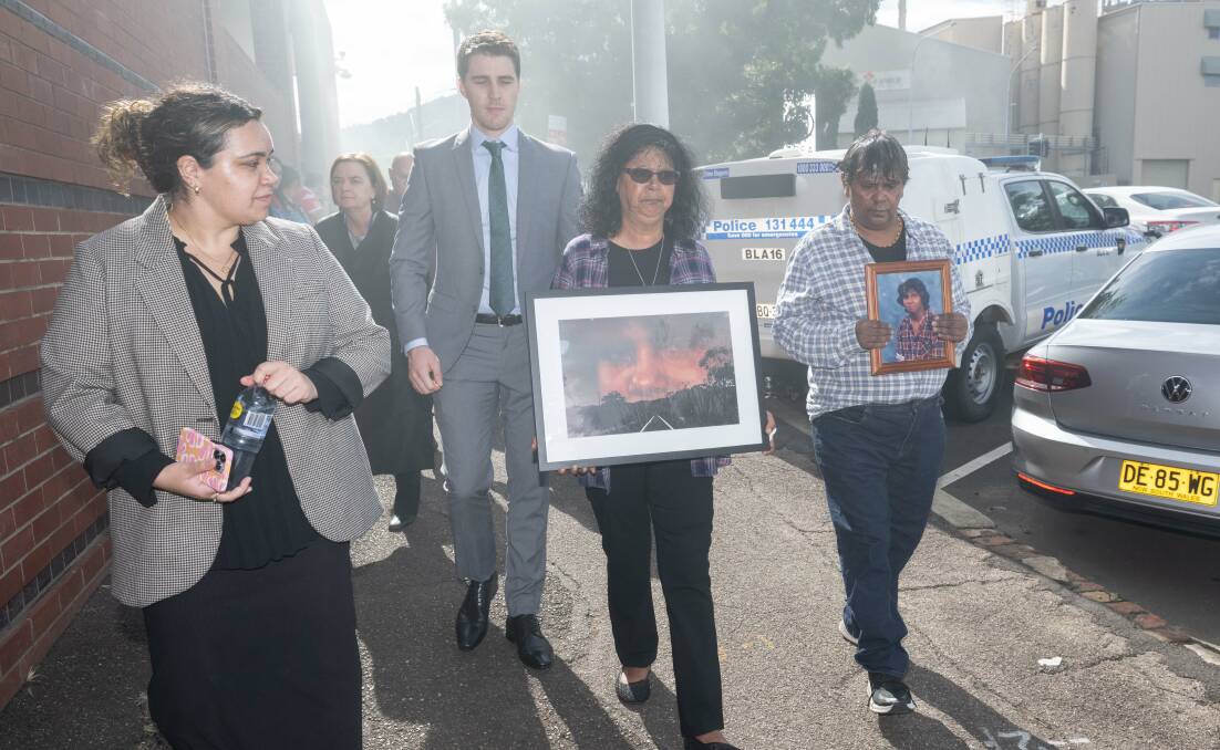 Mark Anthony Haine's sister Lorna and brother Ron held photos of Mark as they walked into Tamworth Court House. Picture by Peter Hardin