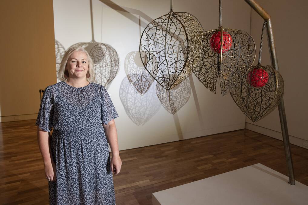 ON DISPLAY: Karen Balsar with her sculpture titled 'The Strength Within' at the Blindspot exhibition earlier this year. Photo: Peter Hardin