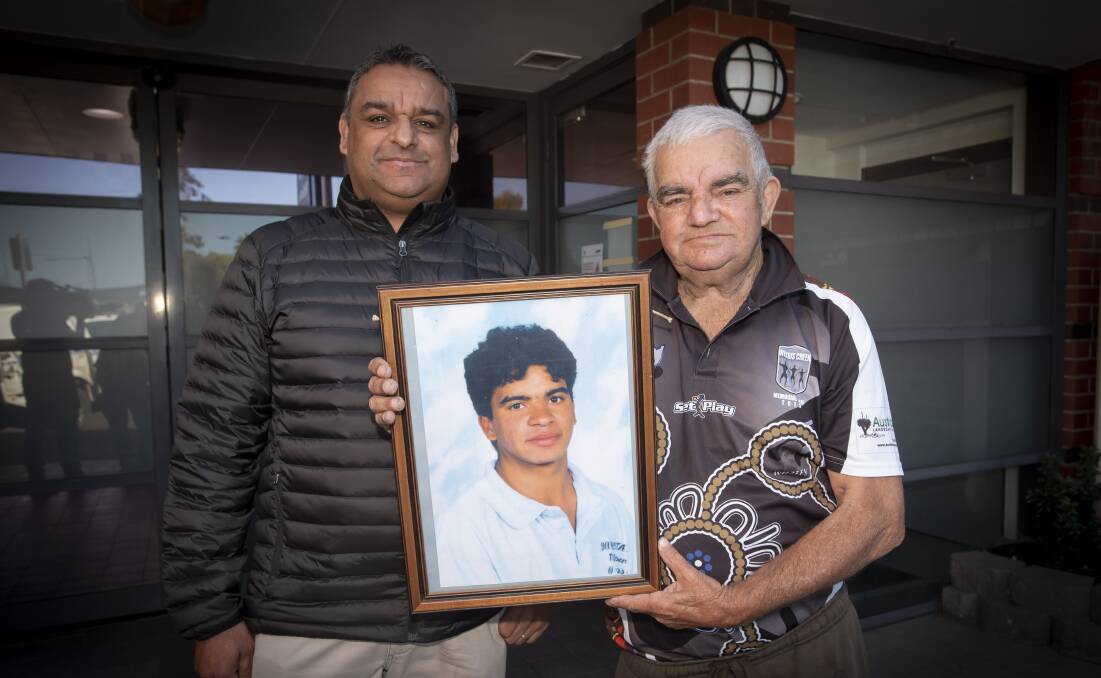 APPEAL: Jason Smith and Stephen Smith with photo of son and brother Stephen Smith who died in 1995. Photo: Peter Hardin