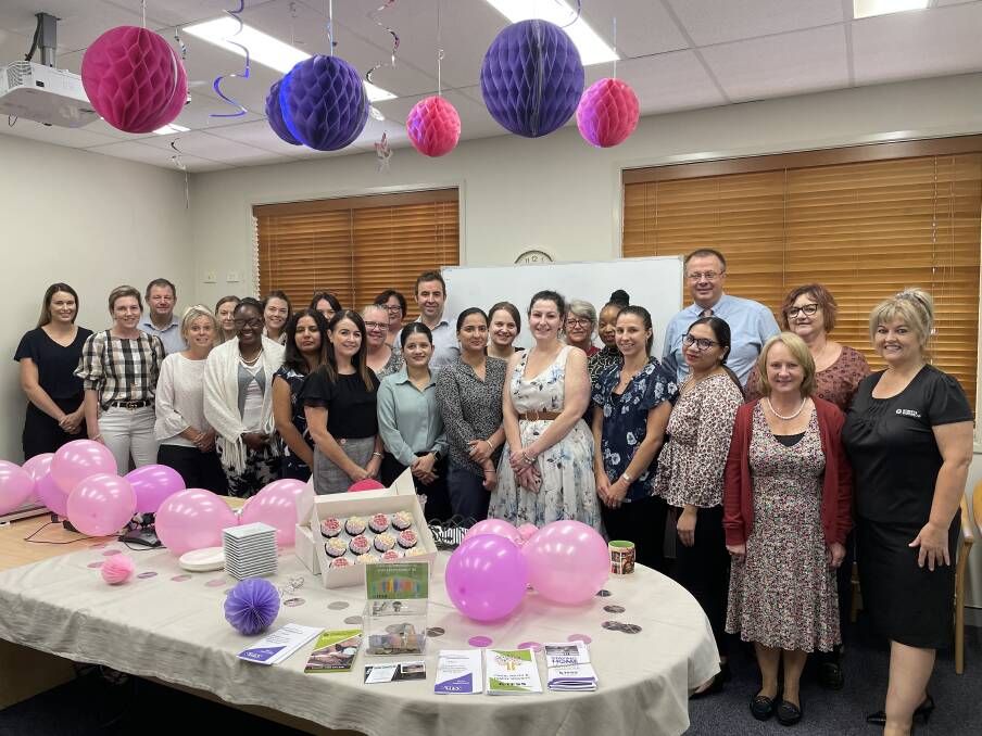 HELPING OUT: Roberts & Morrow staff gather to share morning tea and raise money. Photo: Tess Kelly