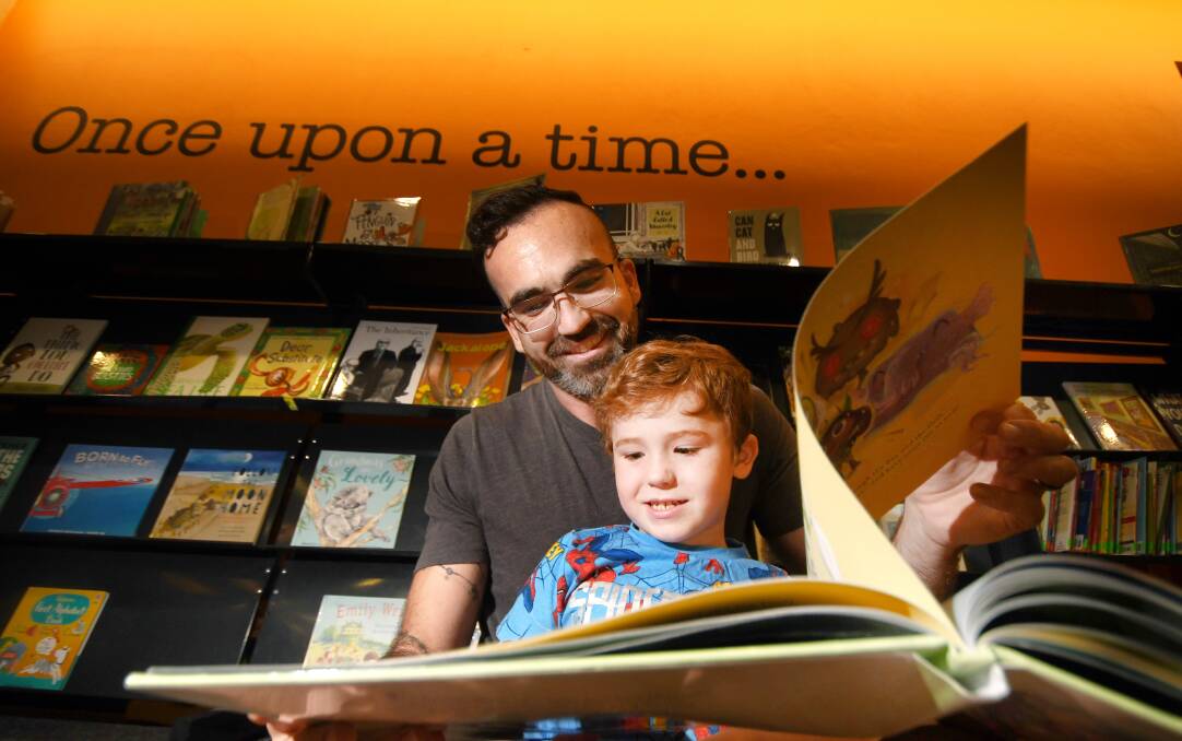 STORY TIME: Paul Holmes and five-year-old son Max get lost in books together every night. Photo: Gareth Gardner