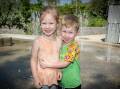 Maisie Coleman and William Johnston cool off at the Tamworth splash pad on the last day of summer. Picture by Peter Hardin