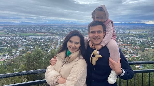 ARRIVED: Julia, Daneliia and Volodymyr Siedov at Tamworth's Oxley Lookout. Photo: Supplied
