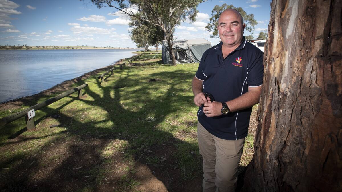 FULL TO THE BRIM: Lake Keepit Reflections Park Manager Leith Smith is keen to welcome tourists back with a special discount. Photo: Peter Hardin