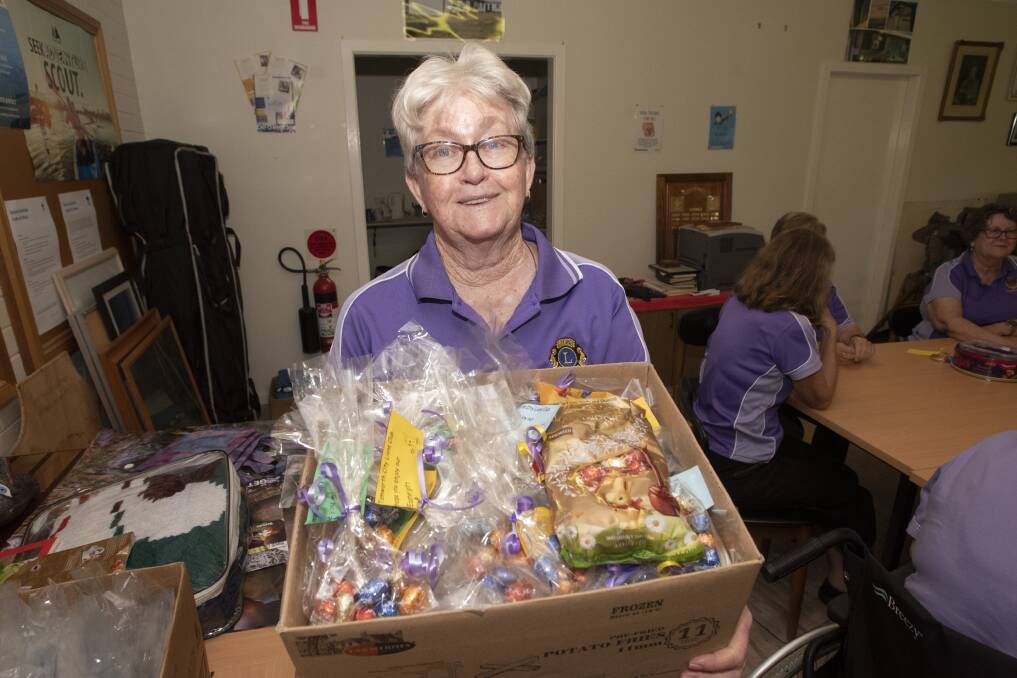 CHOCOLATE: Tamworth City Lions Club member Lesley Callcott with the Easter packages. Photo: Peter Hardin