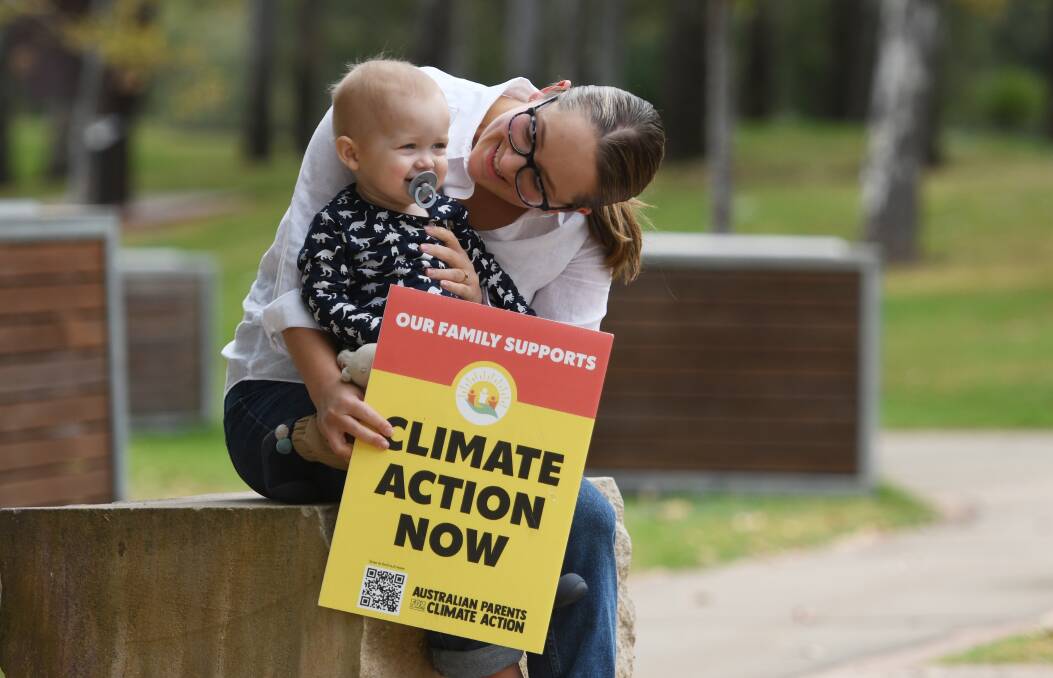 ACTION: Climate picnic organiser Brydie Frazer, with son Wilbur, is concerned for the future of her children. Photo: Gareth Gardner