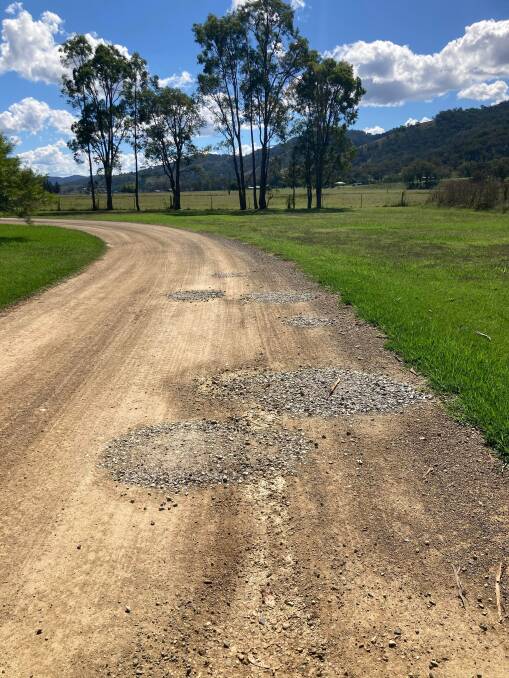 Potholes in residential roads Woolomin filled with gravel. Photo: Supplied