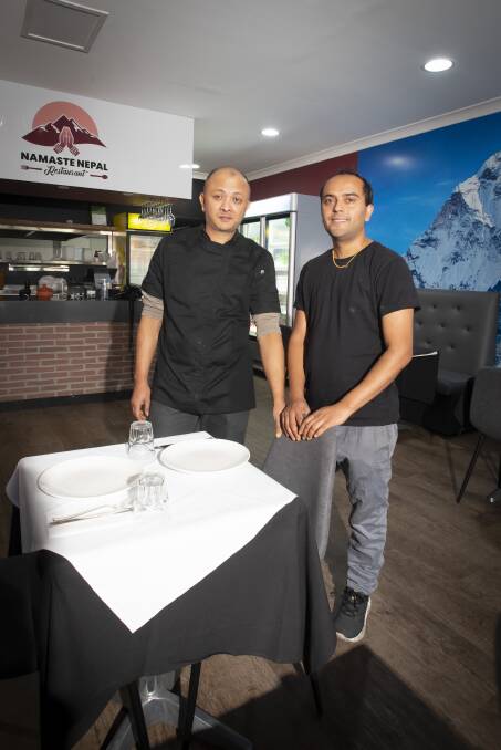 CUISINE: Prashant Udaya and Bikash Sapkota. His Peel Street restaurant Namaste Nepal comes complete with a picture of Mount Everest. Photo: Peter Hardin
