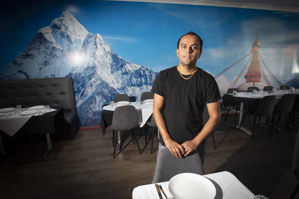 Restaurateur Bikash Sapkota has delayed the opening of his second restaurant to train staff. Photo: Peter Hardin