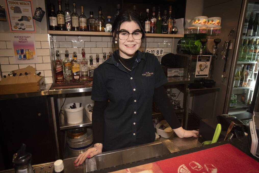 Bartender Andrea Dissinger hasn't had a weekend off since August because the pub is short staffed. Photo: Peter Hardin