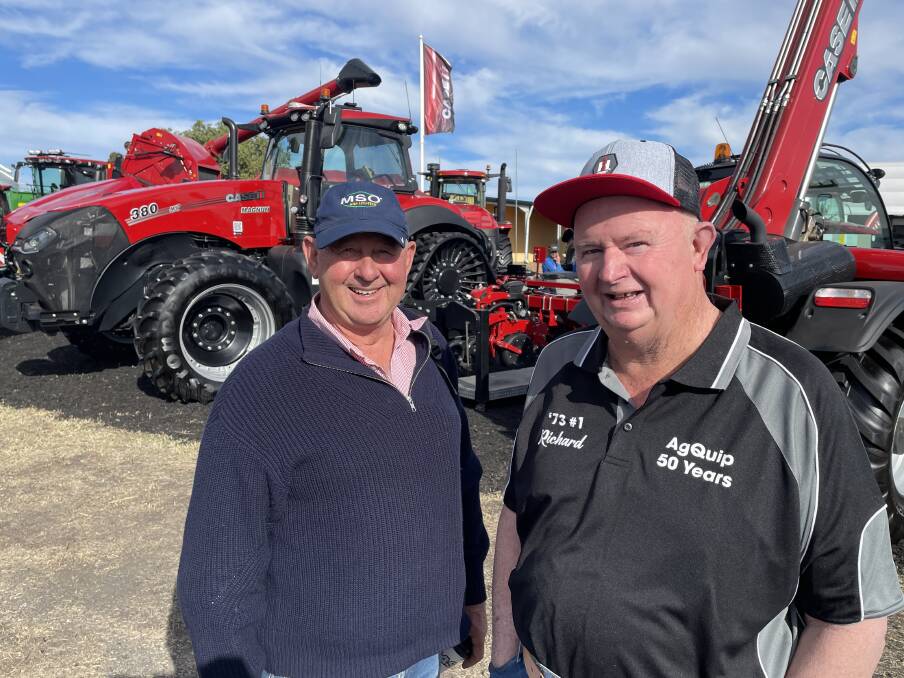 Keith Perrett, Gunnedah, catches up with Richard Betts of Tamworth. Both men were at the first AgQuip at the Gunnedah racecourse. Mr Perrett was still at school while Mr Betts was an apprentice mechanic with Cornish's of Tamworth.