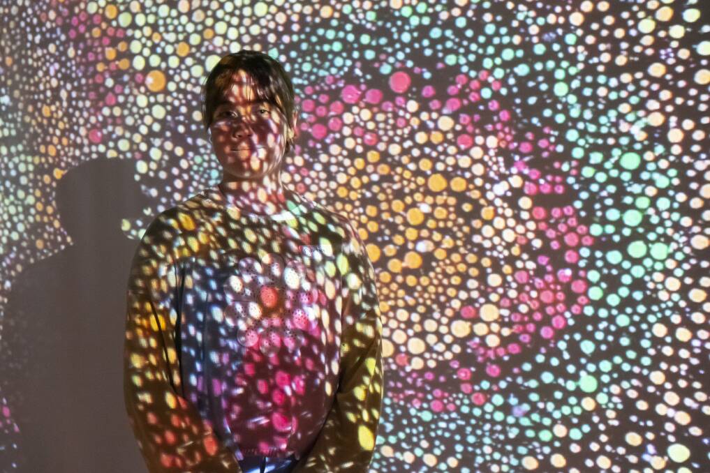 Flower Power: Portia Nell was lit up by the exhibition. Photo: Peter Hardin