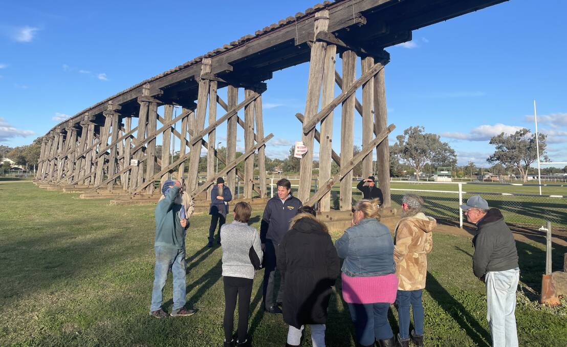Unique Backdrop: Kevin Anderson discusses the viaduct's future in Manilla with locals. Photo: supplied.