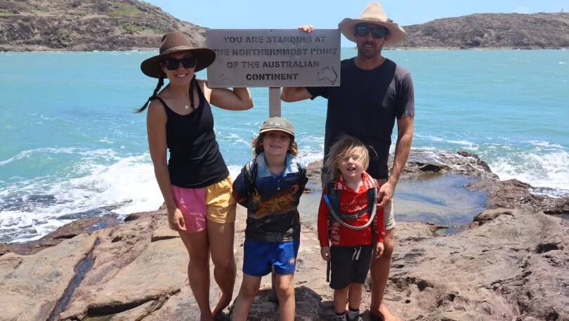 Myo and Barn owner Brooke Carrington, left, with Spencer, 7, Reuben, 4, and her husband Mitch, holding a sign that says the "Northern Most Point of the Australian Continent". Picture supplied