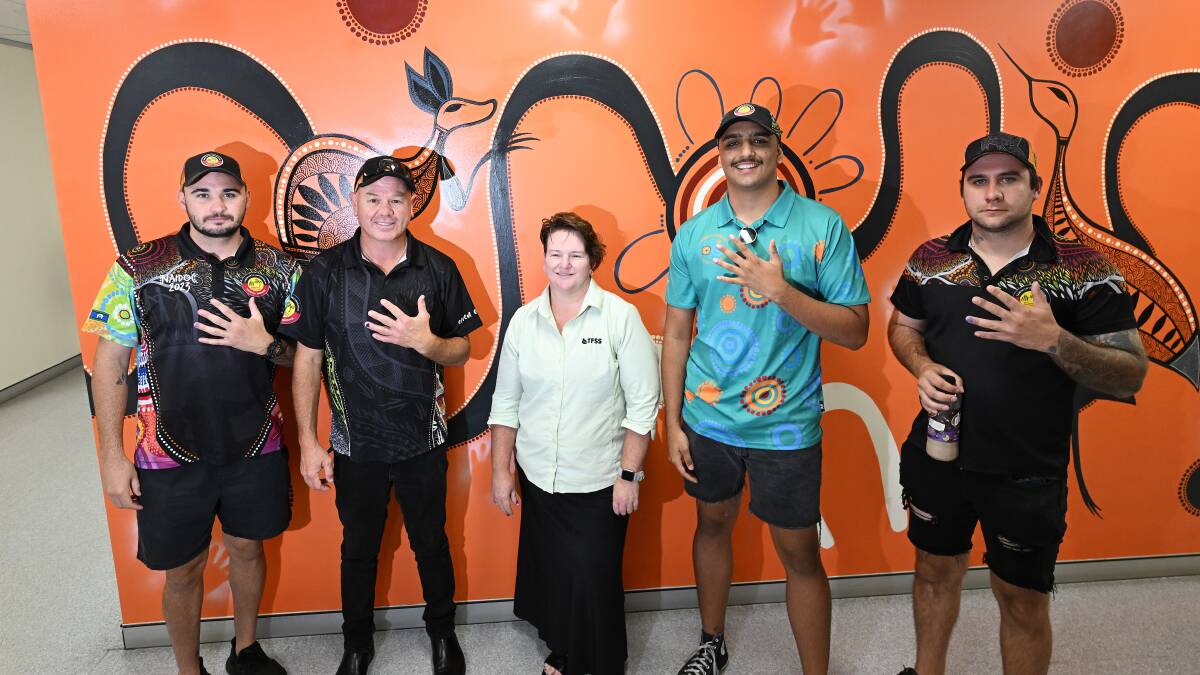 Tamworth Aboriginal Medical Services (TAMS) Trent Taylor, Chris Allan with Tamworth Domestic Violence Committee's Natalie Ryan, TAMS' Stevie Smith and Jeremy D'arcy show off their purple nails for domestic violence awareness. Picture by Gareth Gardner