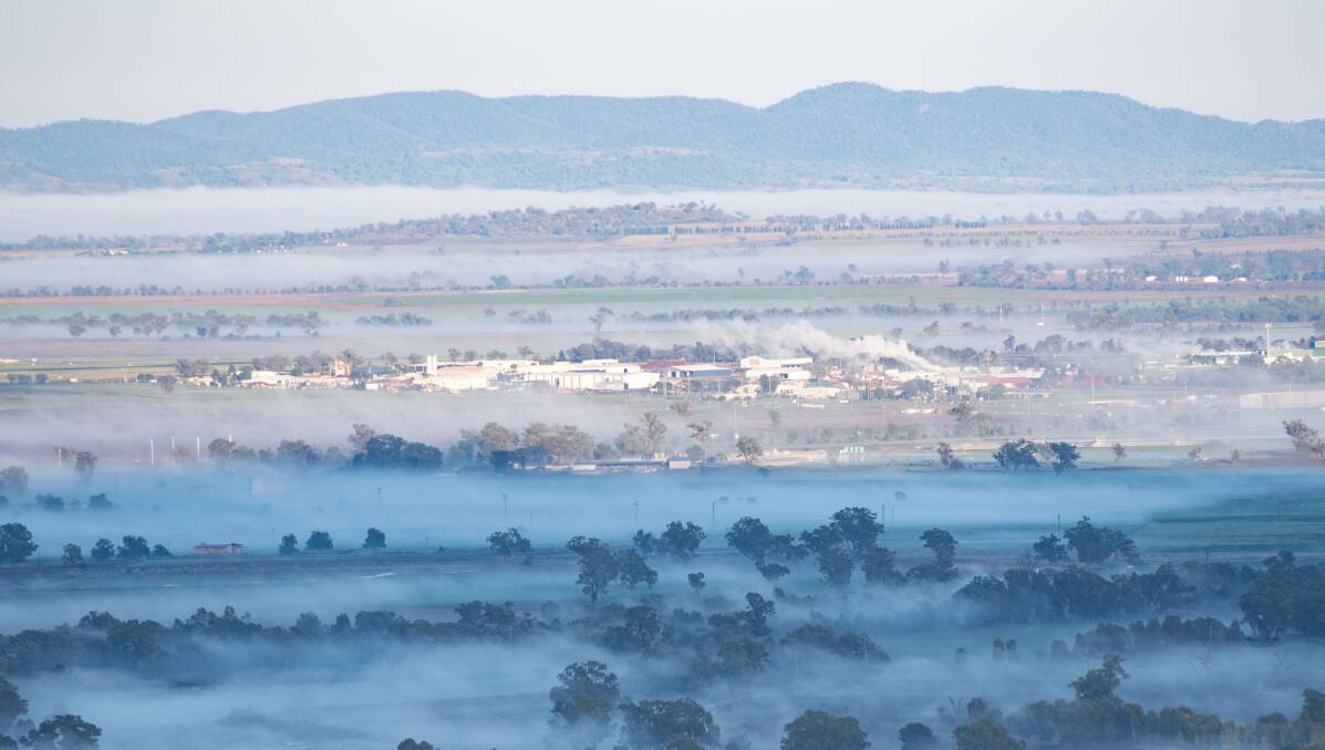 Fog drifts through Tamworth from the vantage point of the Oxley Scenic Lookout. Pictures by Peter Hardin