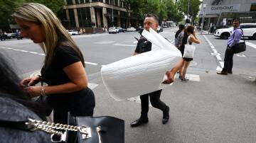 A family member is seen carrying Celeste Manno's urn leaving the Supreme Court of Victoria in Melbourne, Thursday, February 29, 2024. Picture AAP Image