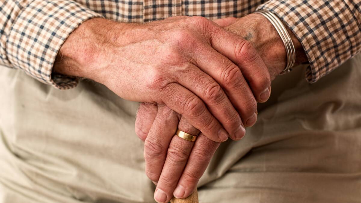 The hands of an older man. Picture via Canva