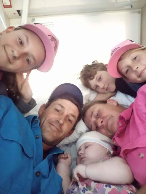 Nathan Kenny and Abby Croft with baby Yara, all centre, surrounded by Yara's siblings. Picture supplied by Abby Croft
