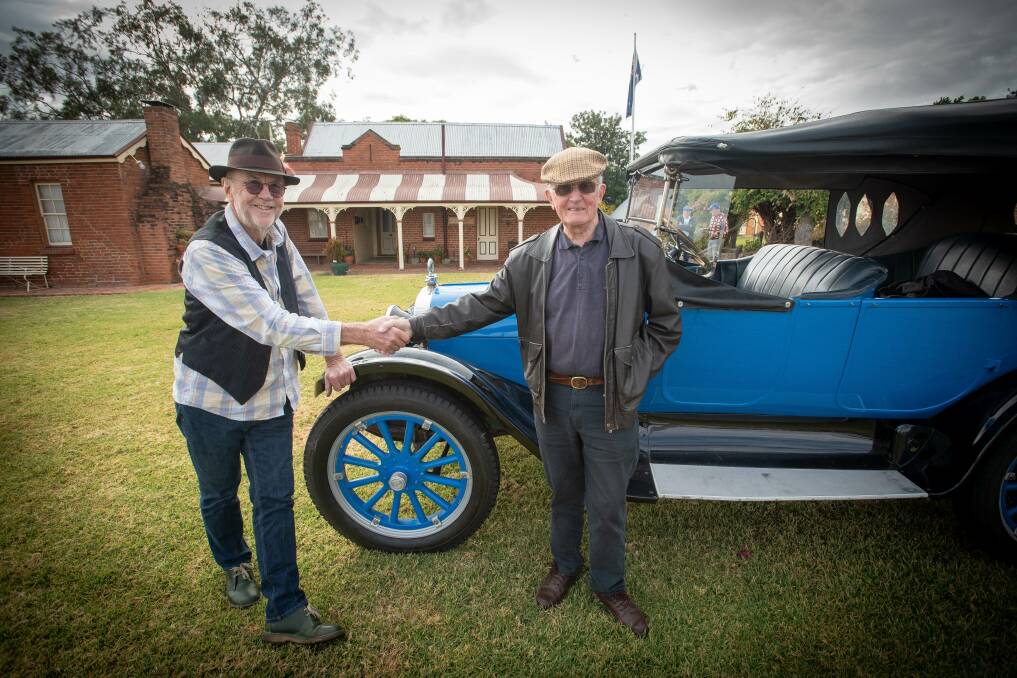 Owner of the 1920 Dodge Tourer Ian Neuss with Tamworth Historical Society President John Vickery. Mr Vickery said Mr Neuss' mother used to be "the backbone of the society". Picture by Peter Hardin