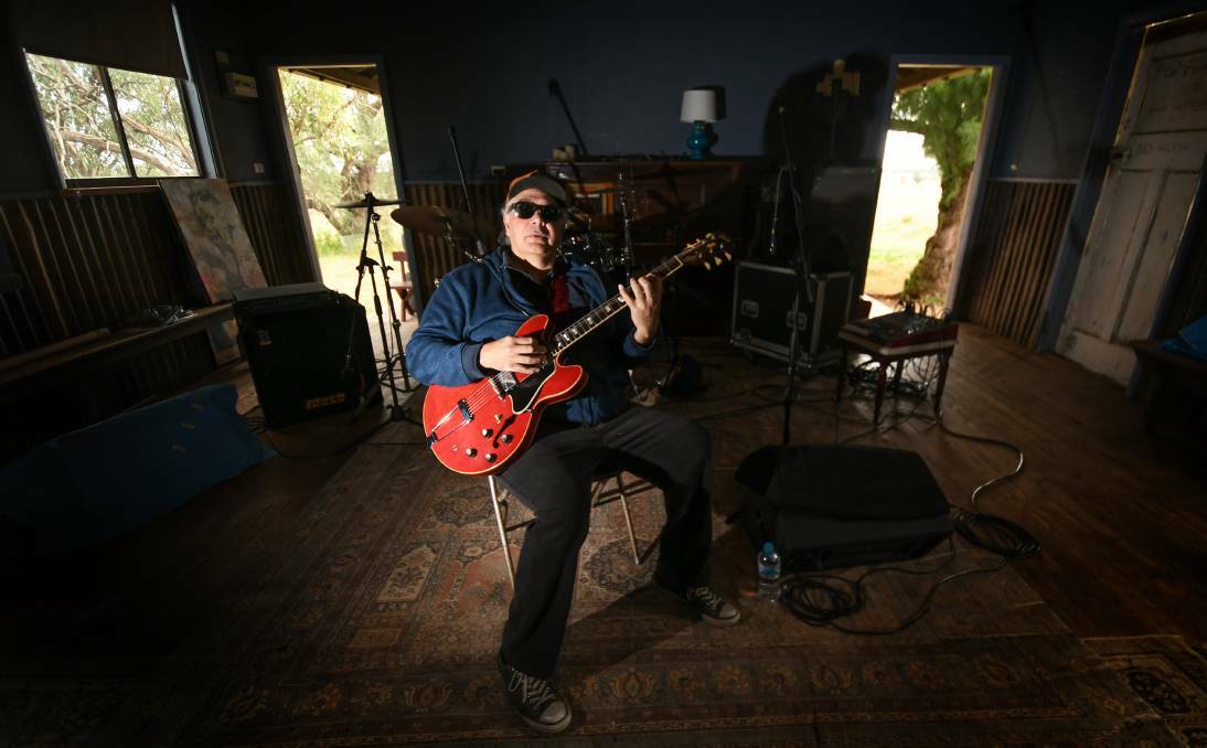 Tamworth legend Buddy Knox in his "boom boom room" with his signature 1967 Gibson 355, watermelon-red guitar. Picture file
