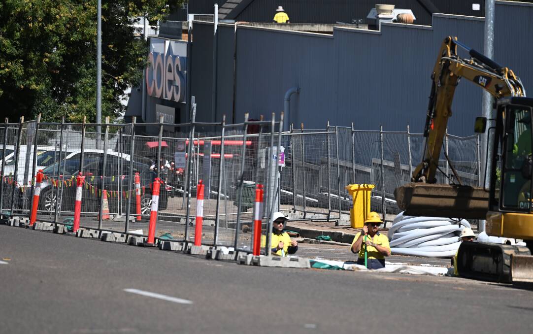 Workers are digging underground 'vaults' on White street to house new trees in the CBD. Picture by Gareth Gardner