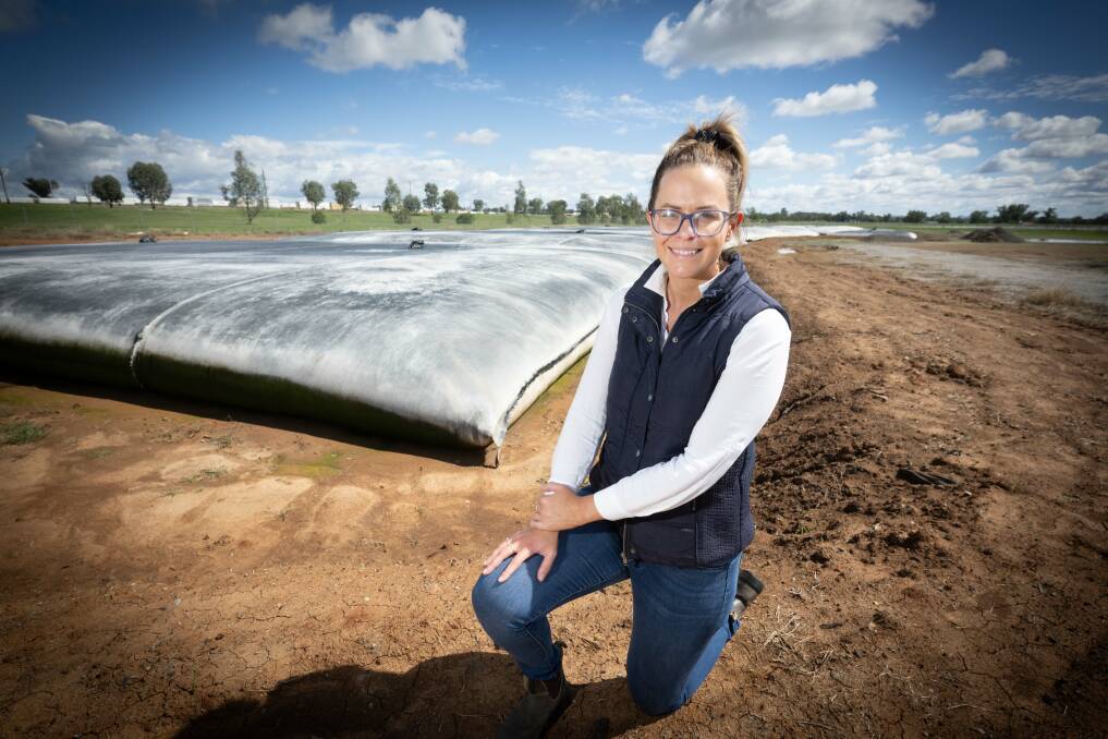 Council environmental operations officer Kate Perryman next to the newly-installed GeoTubes. Picture by Peter Hardin