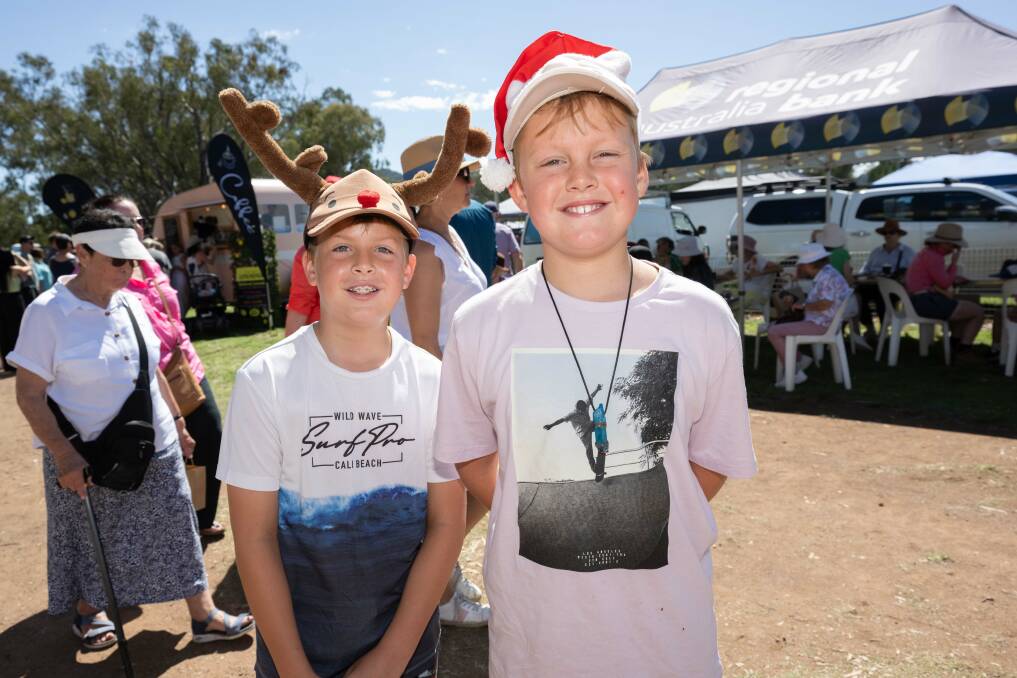 Noah and Joshua Battese get into the Christmas spirit at the biannual Currabubula Boutique Markets on Sunday, December 3. Picture by Peter Hardin