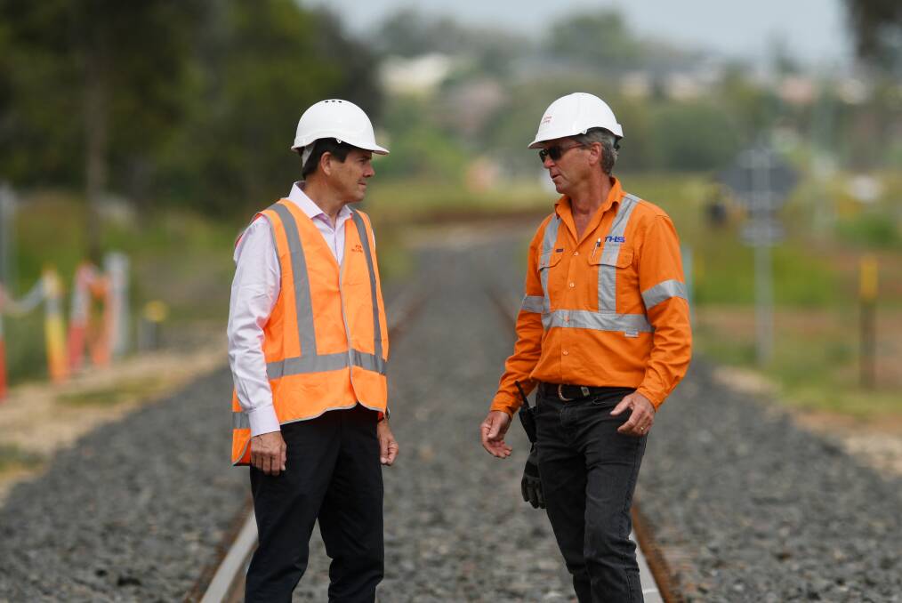 Tamworth MP Kevin Anderson with John Holland construction manager Heath Campbell at the completion of the rail line's construction in 2021. File picture by Gareth Gardner