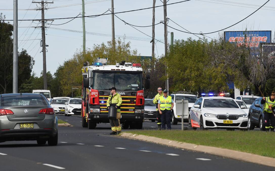 Police and firefighters were seen interviewing witnesses and helping to clear debris and divert traffic on Goonoo Goonoo Road into one lane, around the crash. Picture by Gareth Gardner