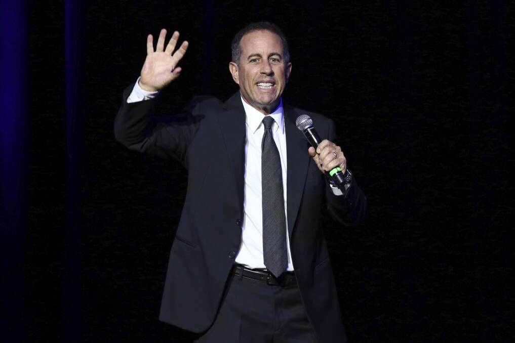 Jerry Seinfeld performing on stage. Photo by Greg Allen/Invision/AP