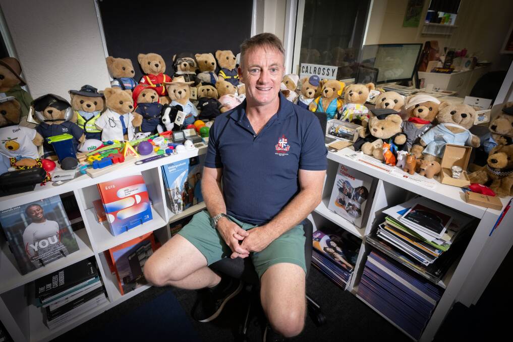 Charles Impey is a proud CareFlight bear collector. He says they allow his students to engage with the different occupations the bears represent. Picture by Peter Hardin