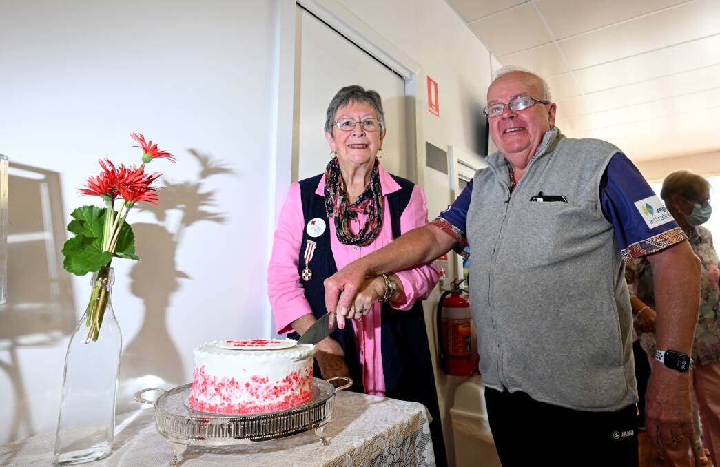 Tamworth Red Cross branch president Helen Lesley and Tamworth treasurer Ken Hall cut the birthday cake to mark 110 years of the organisation. Picture by Gareth Gardner