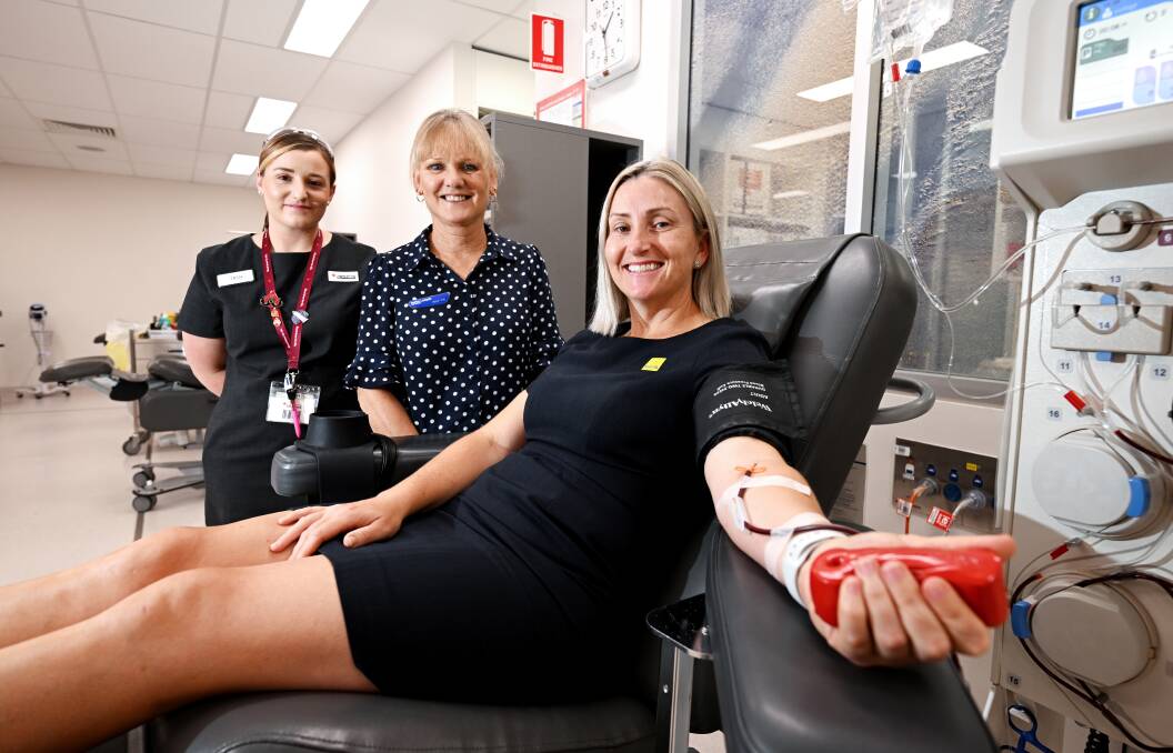 Lifeblood registered nurse Tash Bartlett and Karen Vial from Burke & Smyth, with Rebecca Saunders from Ray White, who is donating her plasma for the Red Cross Lifeblood Challenge. Picture by Gareth Gardner