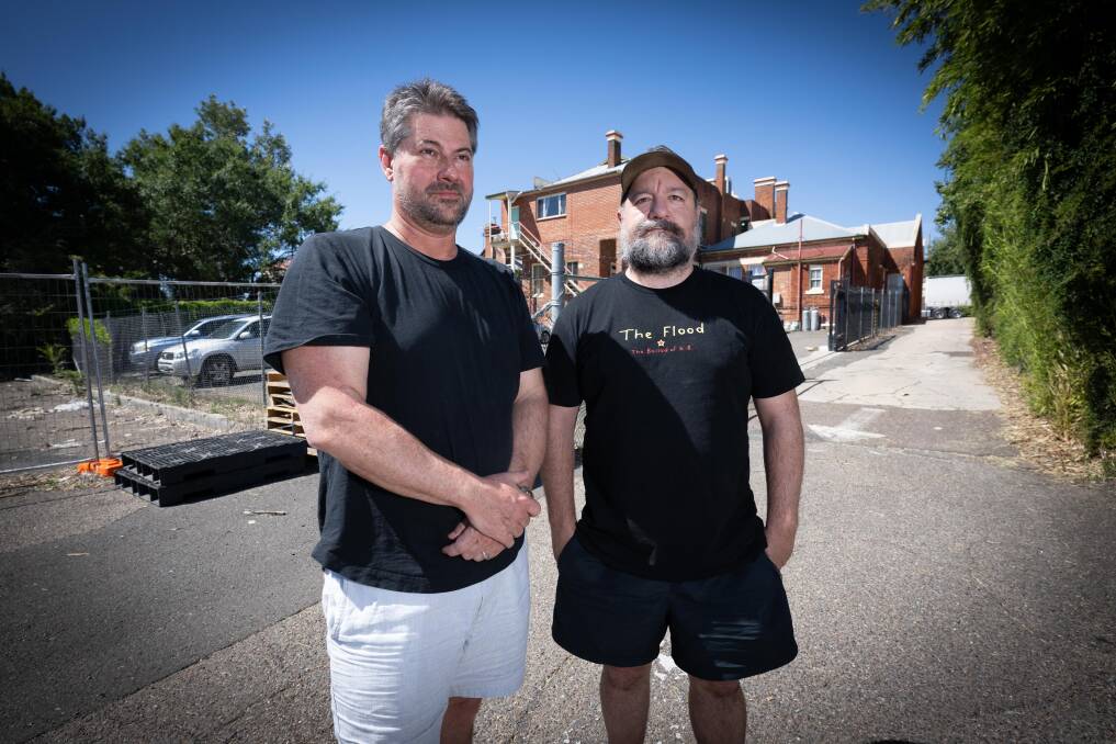 Co-owners of the Tamworth Hotel Dan Whitten and Luke Prout stand on the border where the development will meet. Picture by Peter Hardin