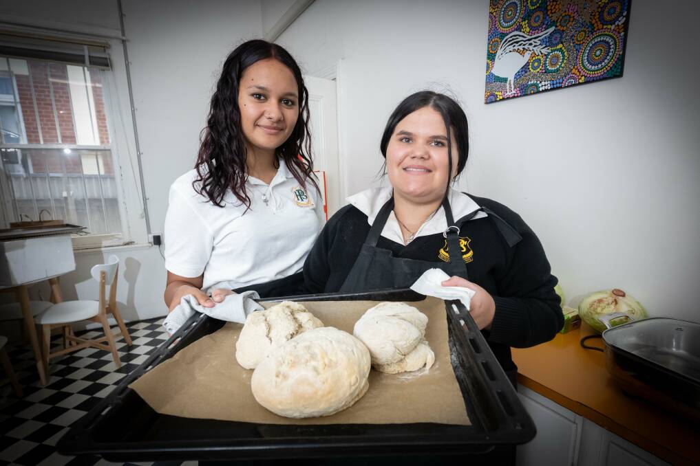 Erika McDonald and Giselle Slater have just taken out of the oven their homemade damper. Picture by Peter Hardin.