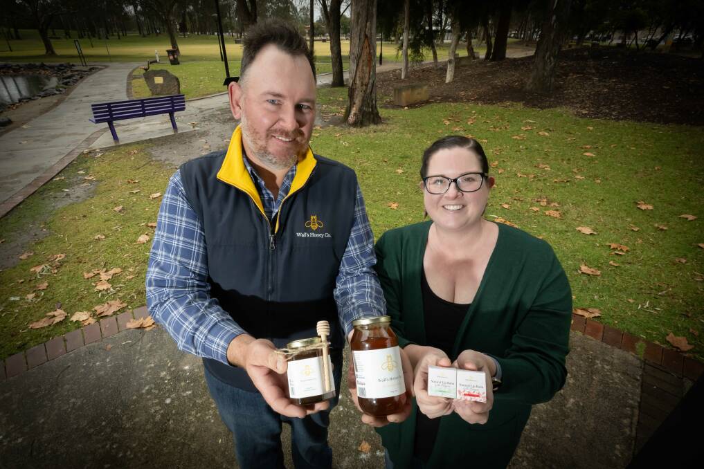Head beekeepers and founders of Walls Honey Co Justin and Katelyn Wall. Picture by Peter Hardin. 