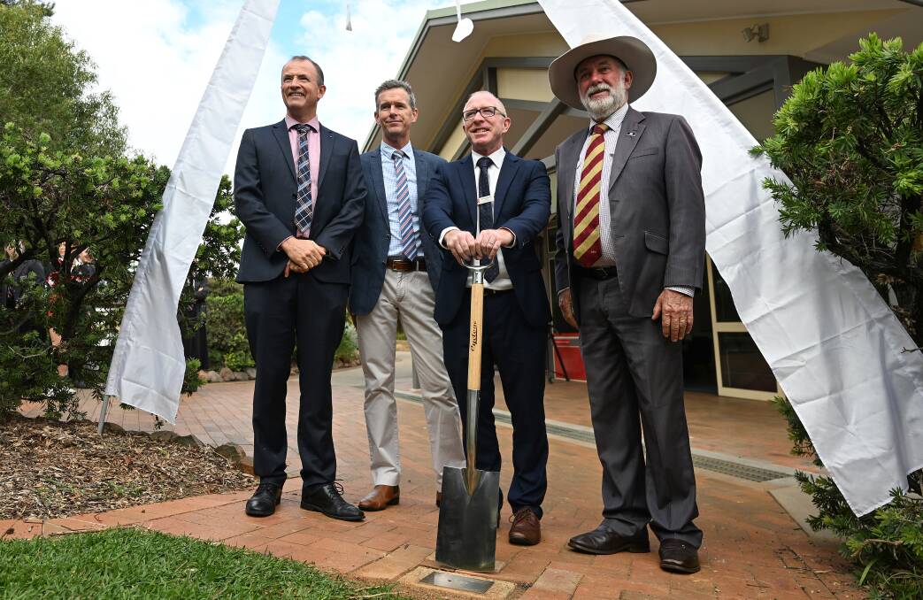 Carinya' Board chair Ross Fotheringham,Carinya business manager Stephen Carter, principal David Jones and Tamworth mayor Russell Webb were on hand to dig up the school's 2004 time capsule as part of the 40th anniversary activities. Picture by Gareth Gardner
