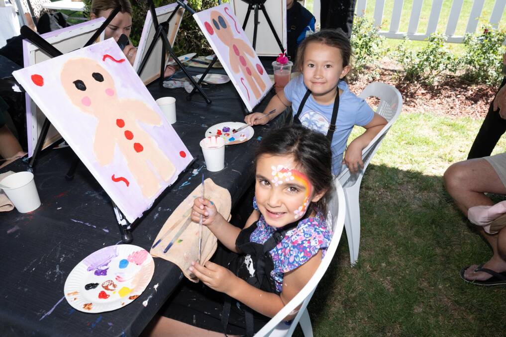 Amelia Greenway and Xixi Lu unleashed their inner artists at the 20th annual Brain Foundation Christmas Fair on Sunday, November 19. Picture by Peter Hardin