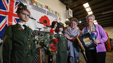 Belinda Mann and Kerry Latimore take a closer look at the Anzac Day display which was featured in One of a Kind, in Taminda. Picture by Gareth Gardner